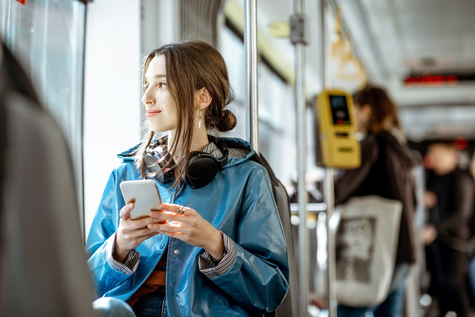 woman usingcats transit guide for story university north residents smartphone on tram
